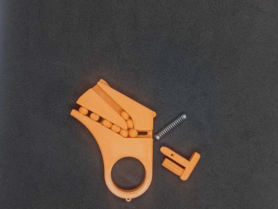 Mini Pistolet Fidget Magazynkowy – Brelok 3D na Kulki (BB)