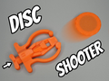 Wyrzutnia Żetonów Fidget Toy + 2 Żetony Zabawka Antystresowa Zręcznościowa